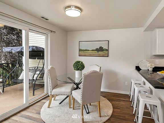 Slider off the dining room leads to the oversize patio with garden views. 