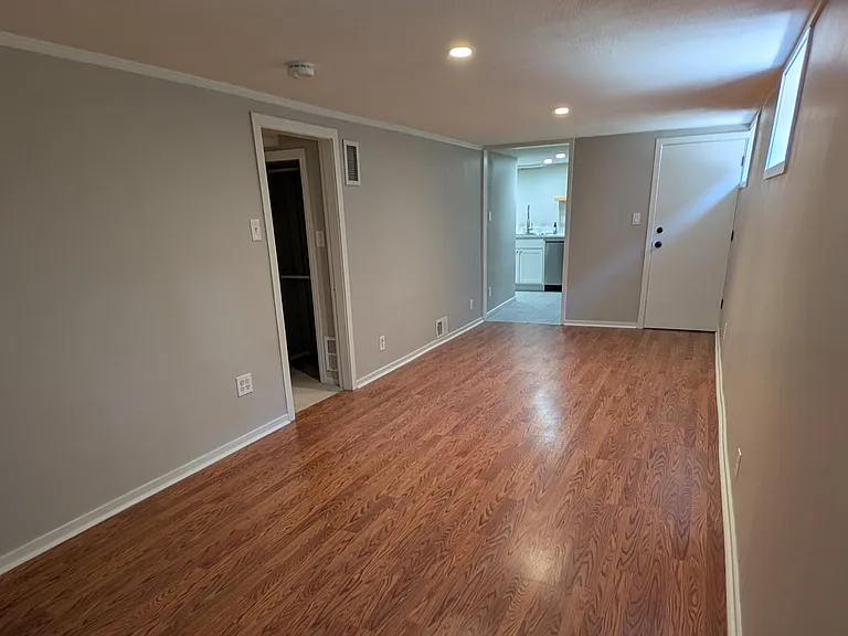 View of living space facing towards apartment entrance