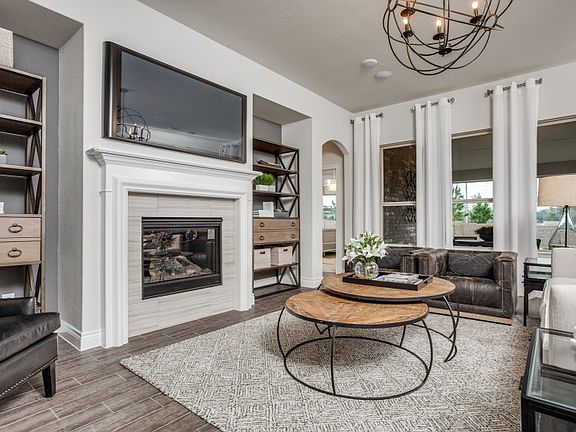 Gathering room with optional fireplace and view of backyard model representation