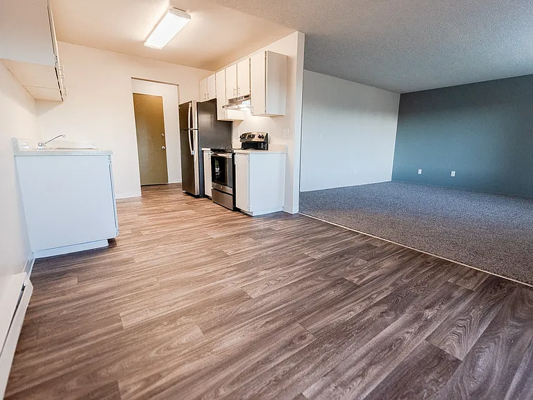 Lakewood Apartments - Arbor Pointe Apartments - Dining Room, Kitchen, Entryway, and Living Room