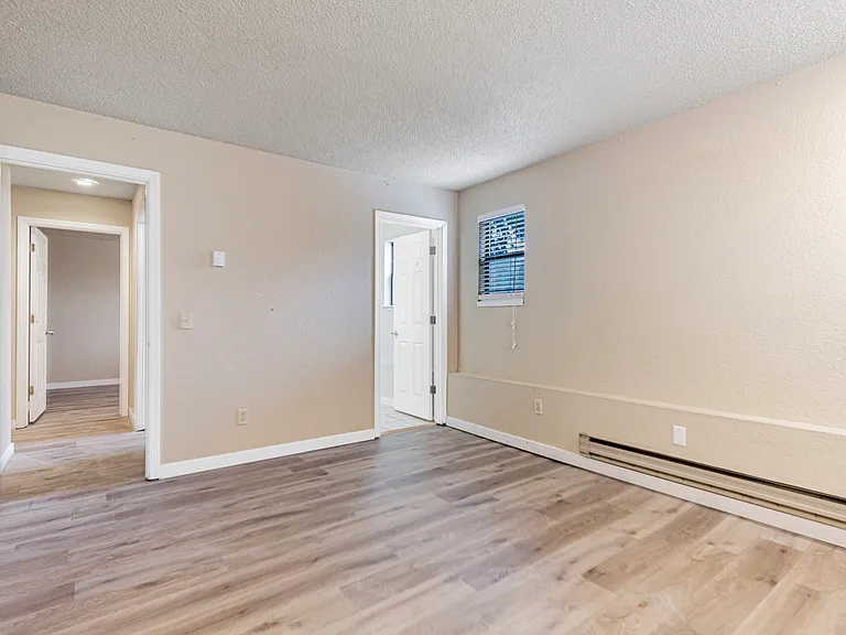 Master spacious bedroom with new floor and entrance door access bathroom