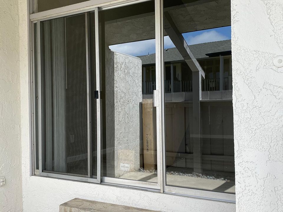 Access to patio from Apartment - Windows covering the whole wall