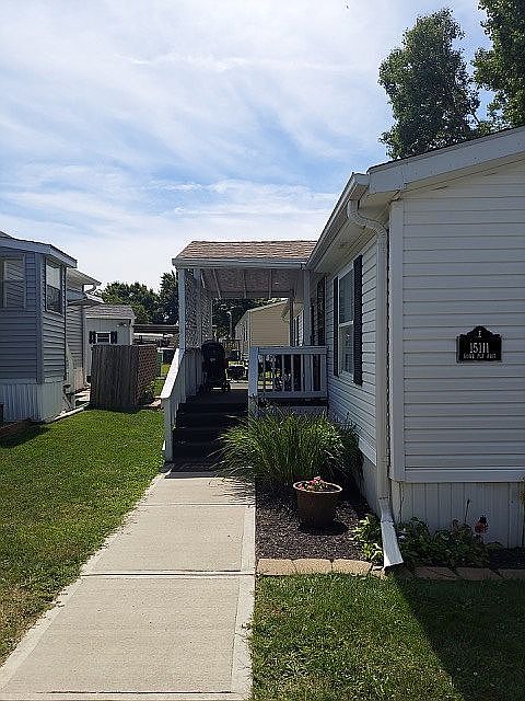 Covered carpeted front porch
