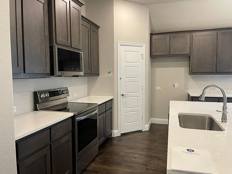 Kitchen with Quartz counter, SS Sink and LG SS Appliances