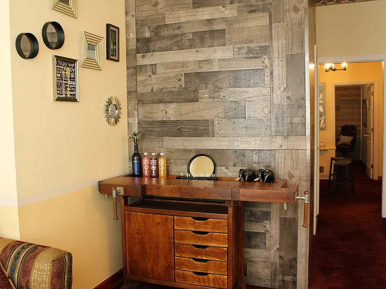 Living room with view into kitchen