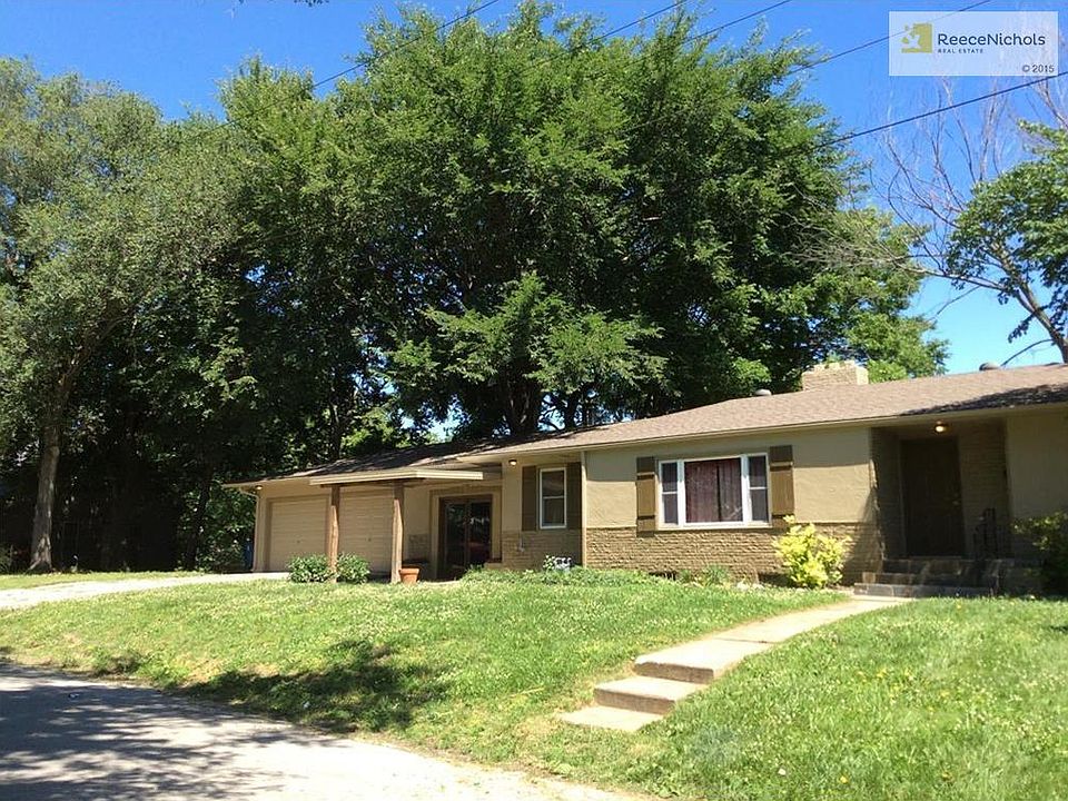 Stucco on front - sits on corner lot.