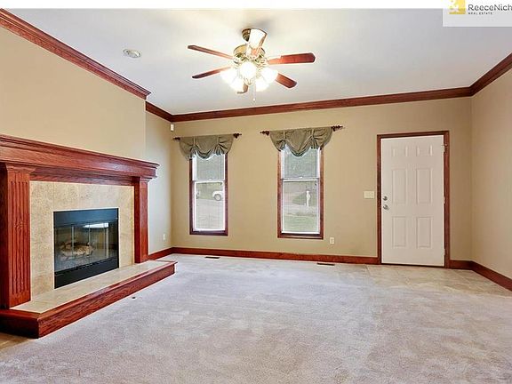 Marble fireplace with custom moldings in Living Room