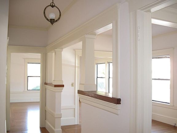 A peak of the dining room to the right and the living room straight ahead