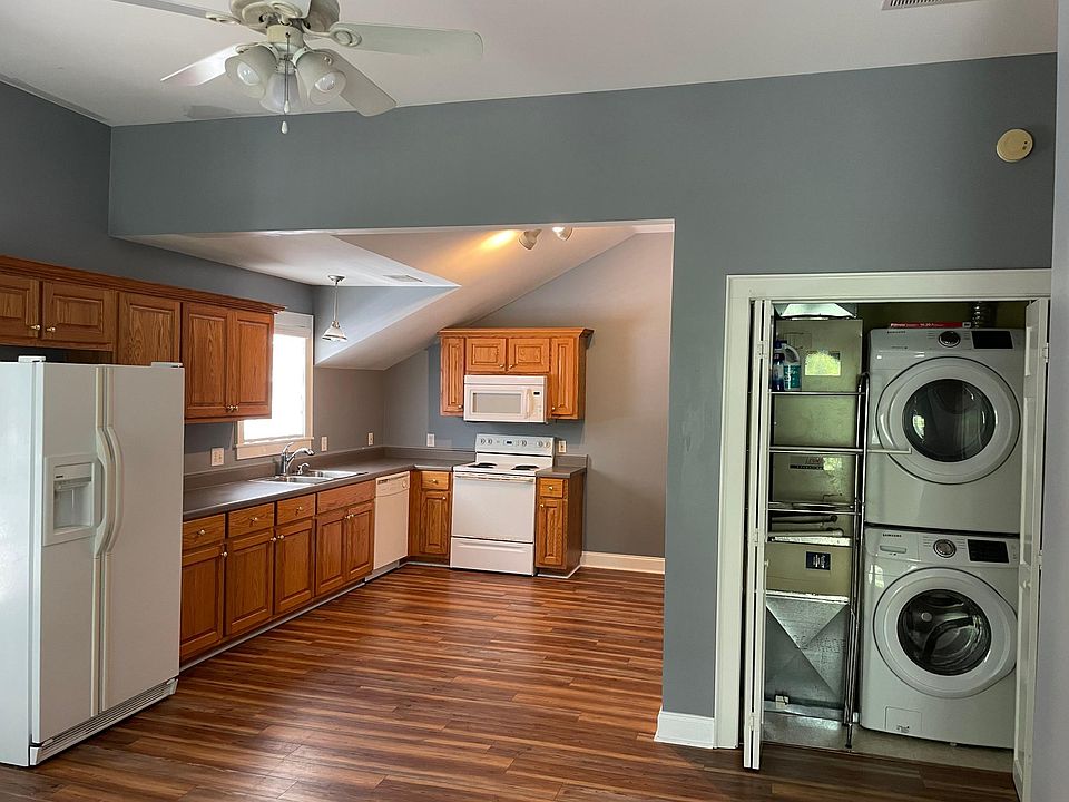 Open floor plan with a large kitchen. The convenient laundry space offers a full-sized washer and dryer.