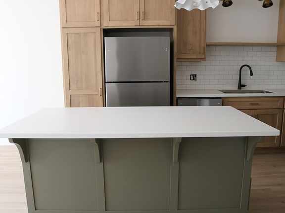 island with storage and bar seating