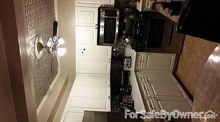 Kitchen
						:
						Updated eat in kitchen with stainless appliances.