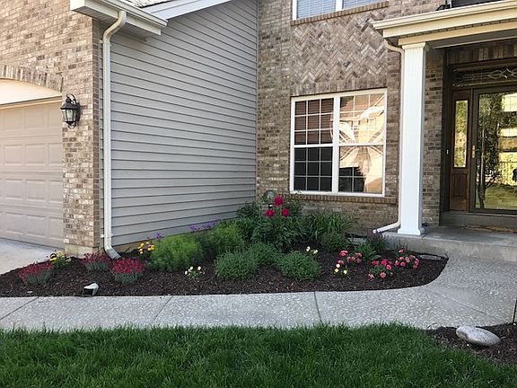 Sprinkler In Flower Bed