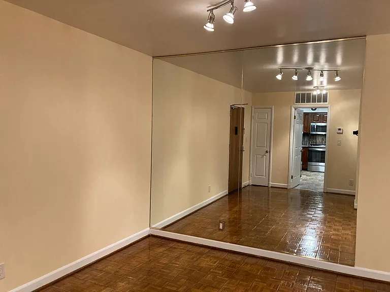 Large floor to ceiling mirrors in living room