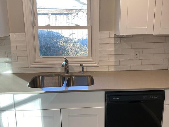 New cab, quartz counters, subway tile in kitchen