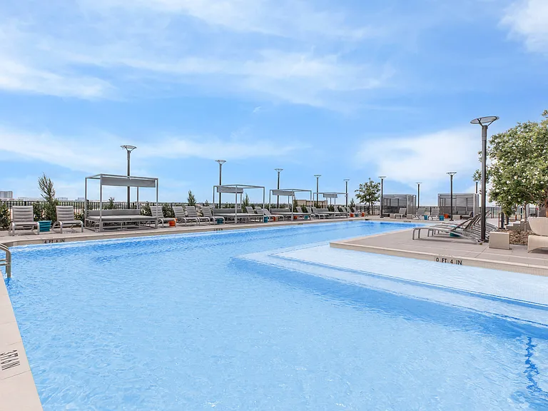 Luxurious Pool Deck with Poolside Cabanas & Lounge Seating