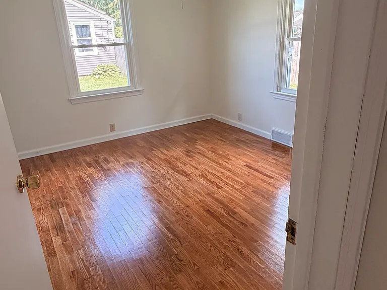 1st bedroom with hardwood floors