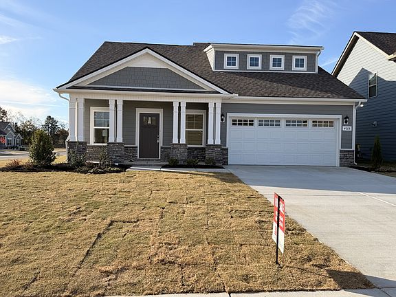 Stunning new home with 3 bedrooms a spacious bonus room sitting on a prominent corner lot with st