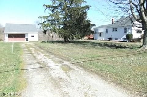 There is a turn around driveway between garage and home.