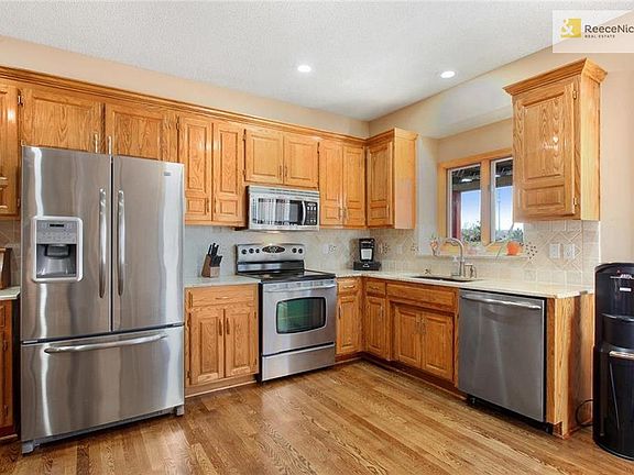 Newer updates include all stainless appliances, recently refinished hardwood floors