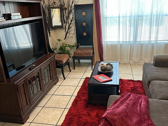 A generously sized main living area, this room features expansive wall space, streamlined finishes, and an open-concept design perfect for modern living. The abundance of natural light ideal for gathering and entertainment.