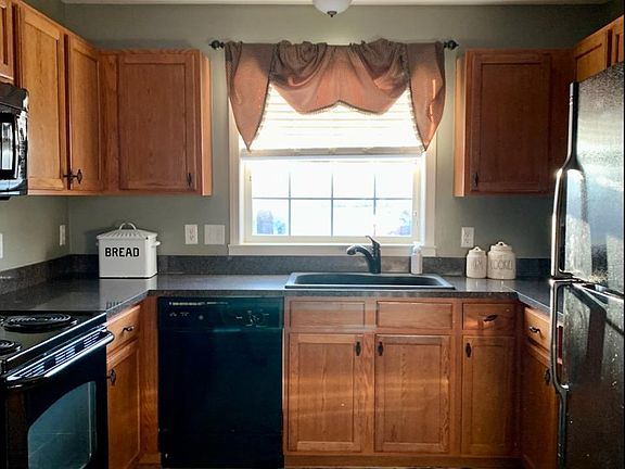 Kitchen. Lots of cupboards, desk area on left, wonderful counterspace.