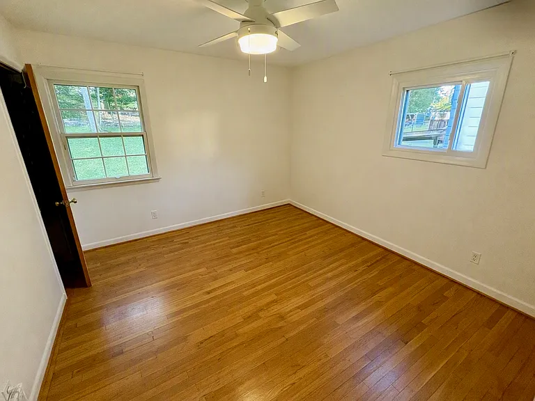 Bedroom 3 with left window facing backyard
