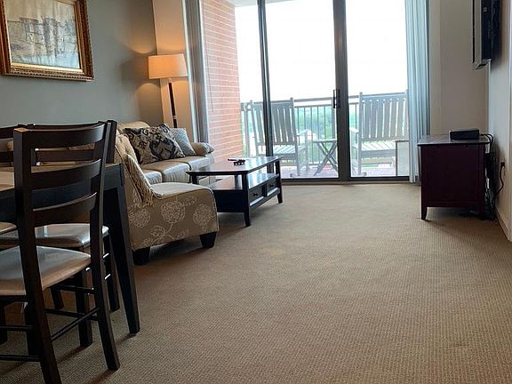 Bright open floor plan with kitchen, dining room, and living room