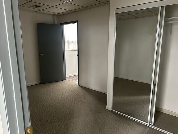 first bedroom with entrance to bathroom 1