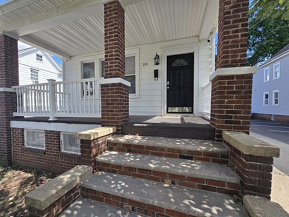 Front entrance with masonry steps and covered front porch.