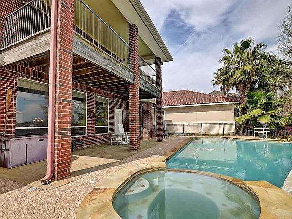 Covered patio and upstairs deck as well. Pool and hot tub!