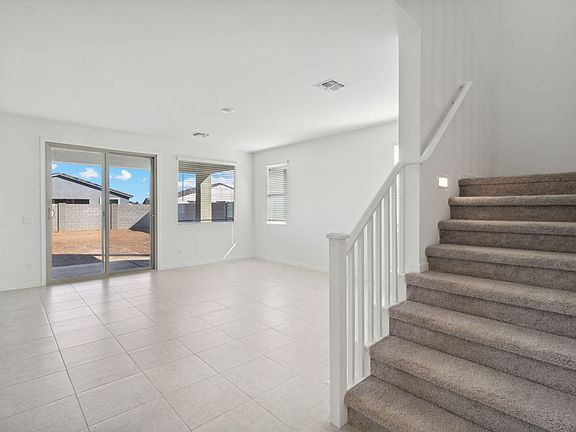Great room with stairwell to loft