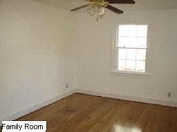Family Room with Newly Finished Hardwood Floors