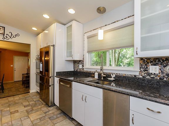 Kitchen opens to the formal dining room.