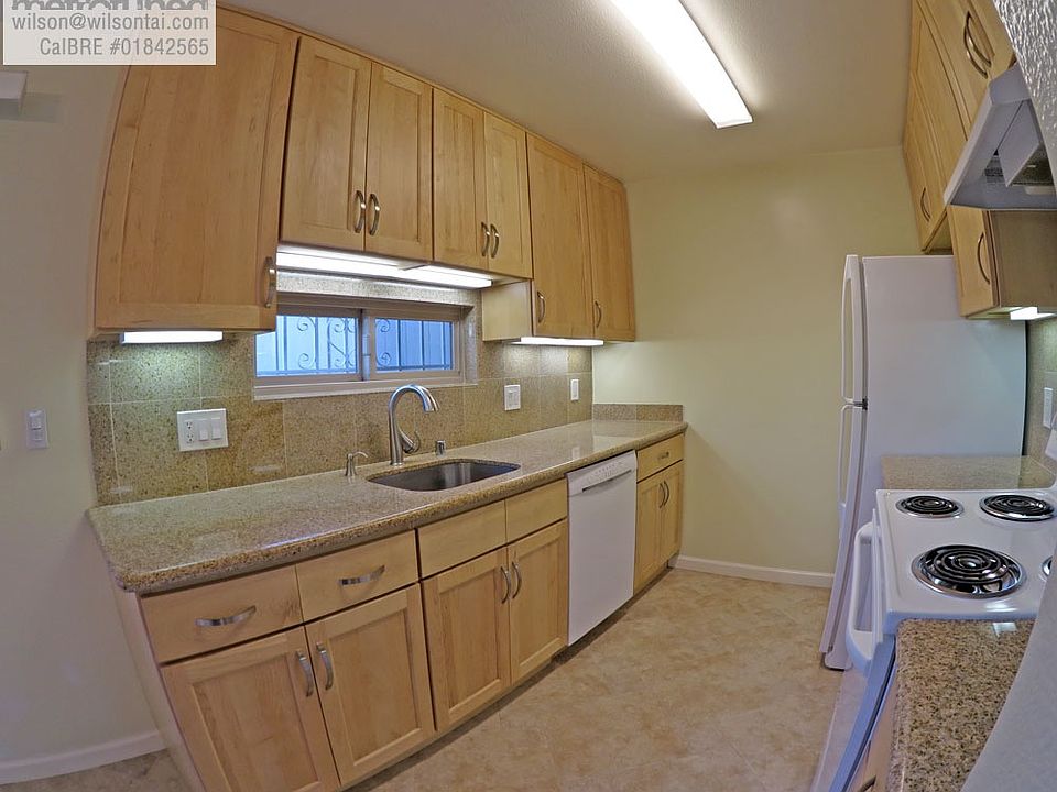 Kitchen with Maple Cabinetry, Granite Countertops, Tile Floo