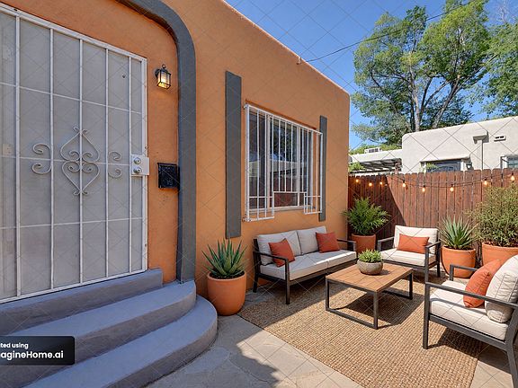 Fresh outdoor furniture highlights the spacious backyard_perfect for relaxing, dining, and entertaining.