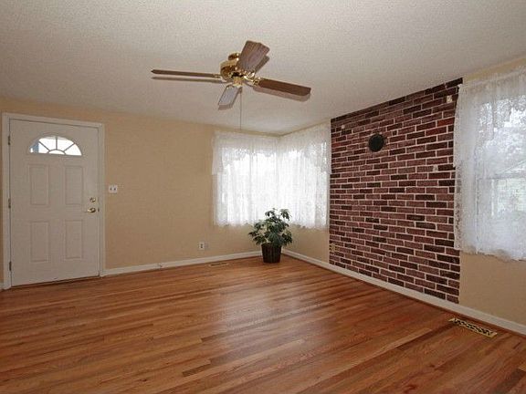Amazing hardwood floors. The firebox is still intact behind this brick front.