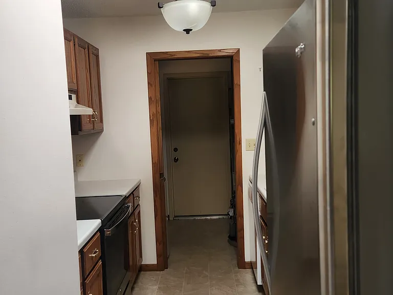 Kitchen has updated stove and refrigerator, dishwasher and disposal