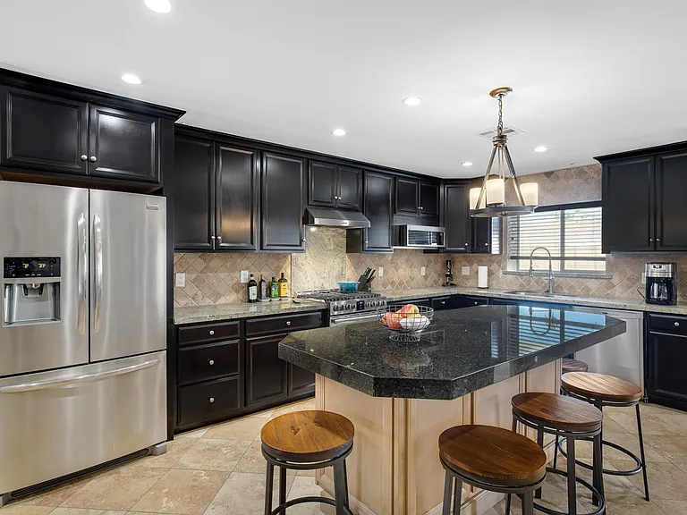 Spacious and fully equipped kitchen with large island that seats up to 6.