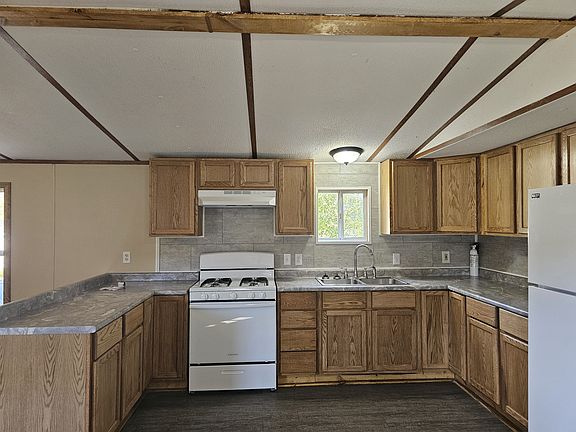 Brand new kitchen cabinets, counter, appliances, sink. Completely redone.