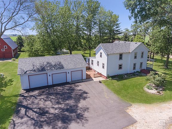 2 year old roofs on the house, garage, and 3 story red barn.