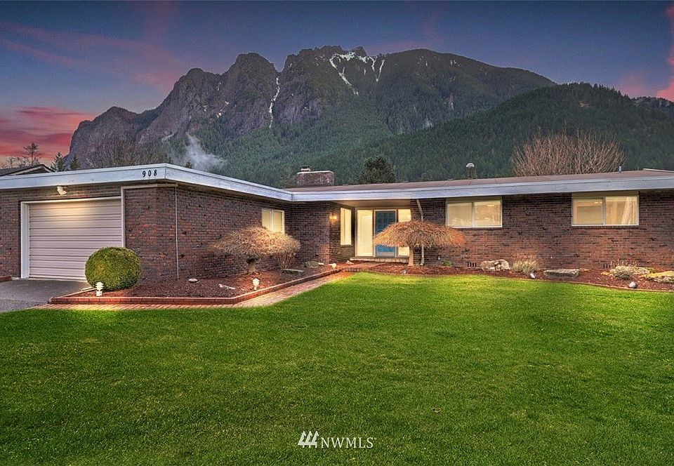 Breathtaking views of Mt Si as you stand on the property of this beautiful mid-century modern home.