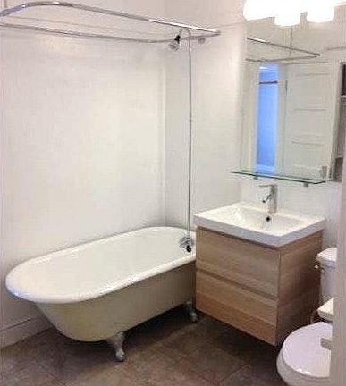 Crawfoot Tub & Modern Sink Cabinet