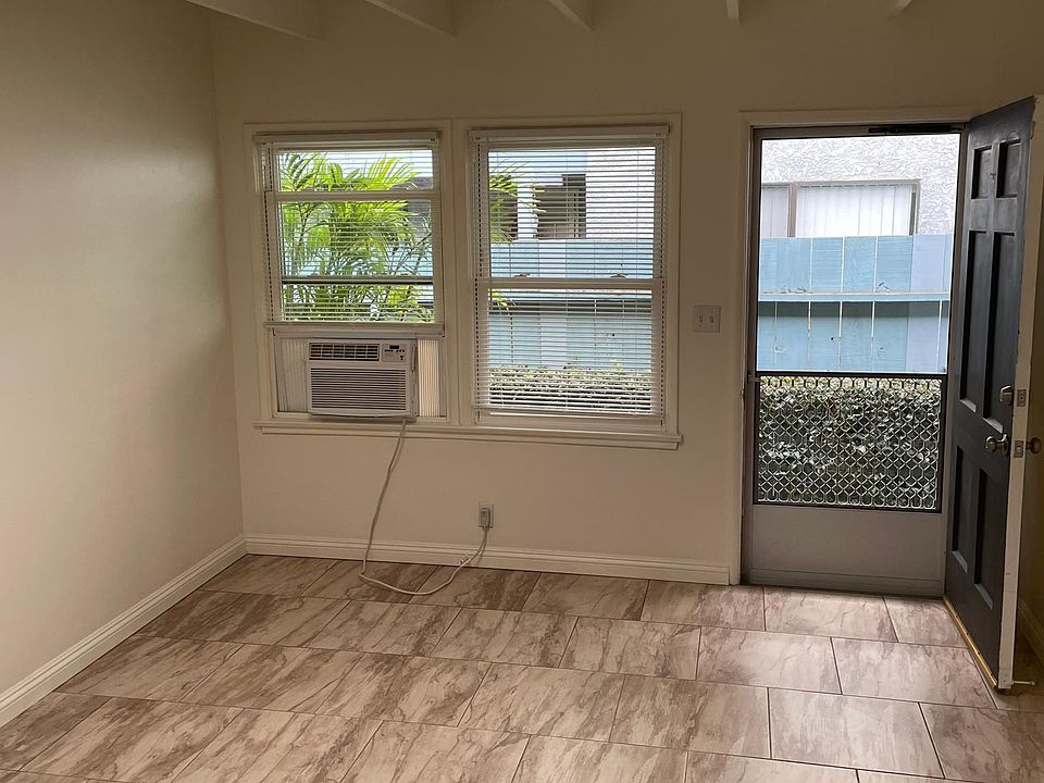 Living room with window AC unit.