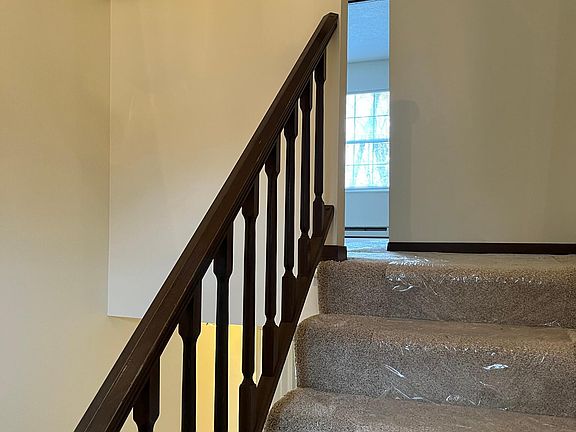 Six steps up from entry to 2 bedrooms, bath, and laundry