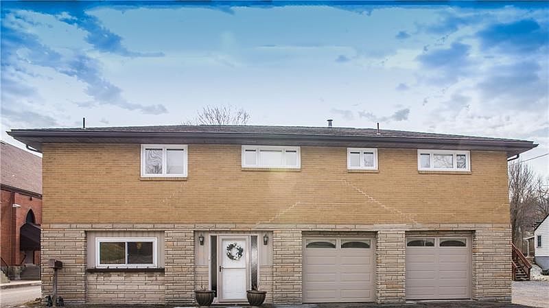 Welcome to 2098 North Road, a brick and stone raised ranch.  Notice this home has a two-car garage and 3 bedrooms and 2 full bat