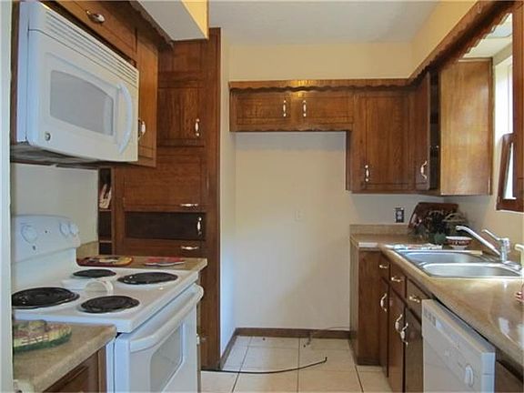 HOMEY WARM KITCHEN WITH LOTS OF CABINET SPACE