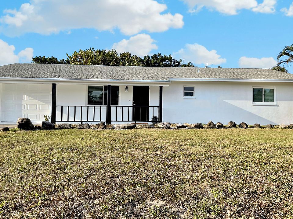 Beautiful newly renovated modern furnished home with hurricane windows, new hvac, outdoor shower, out door kitchen and screened in porch.