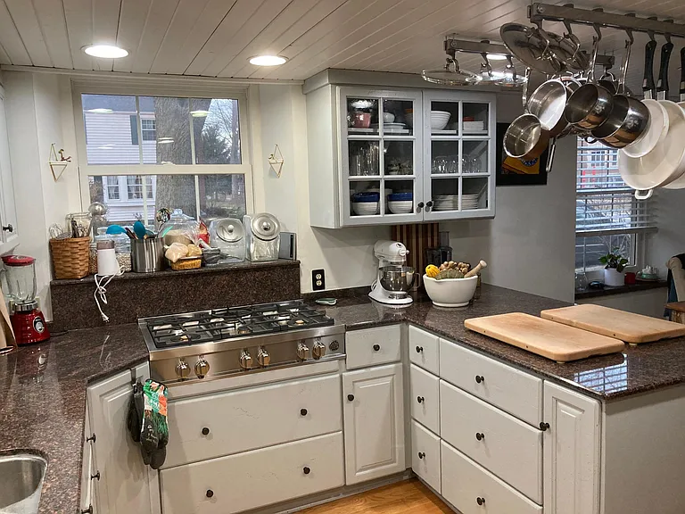 Kitchen with custom cabinetry and granite countertops
