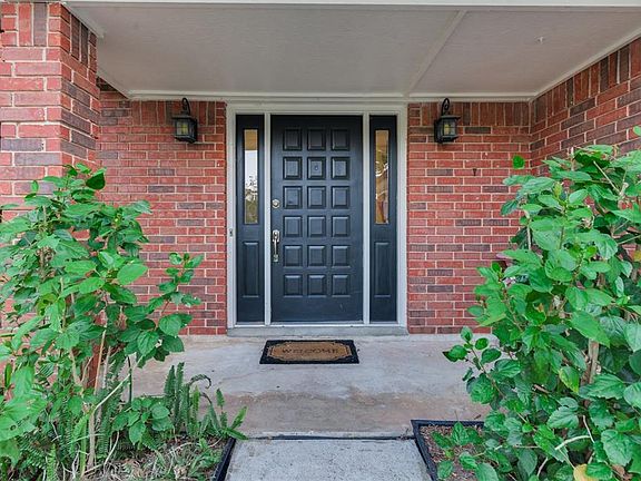 Large Covered Porch boasts an attractive Front Door with Glass Insets on either side that allow the Natural Light from the moment that you enter the home. The Door color matches the Shutters on the windows both Upstairs and Downstairs.