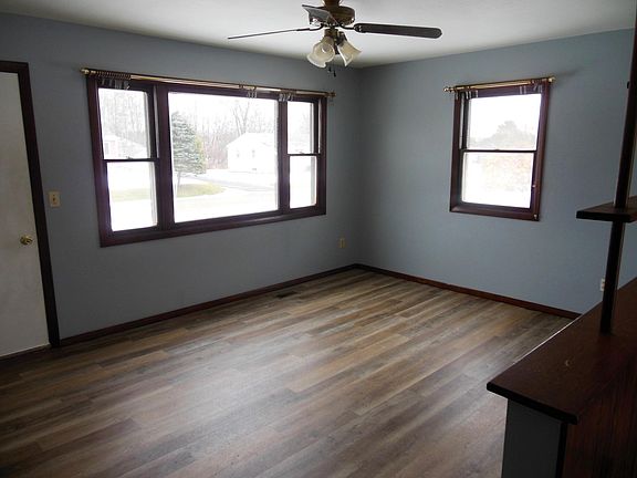 Living room is open concept with kitchen.